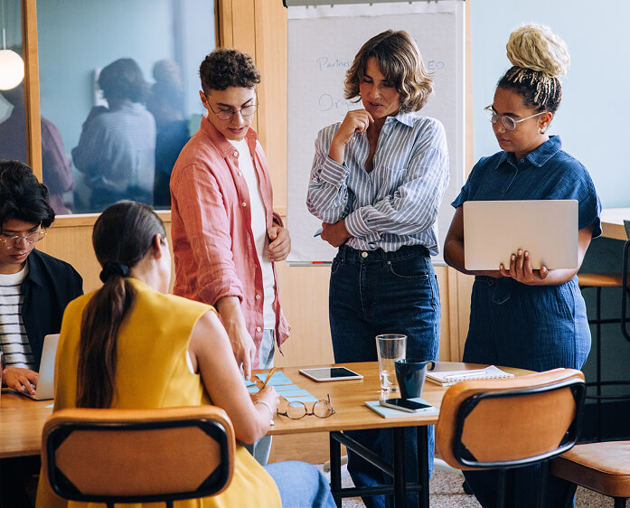 Team of professionals collaborating in a meeting around a table