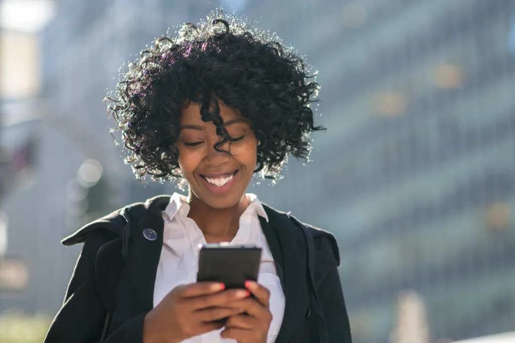 woman checking her LinkedIn on way back from a meeting